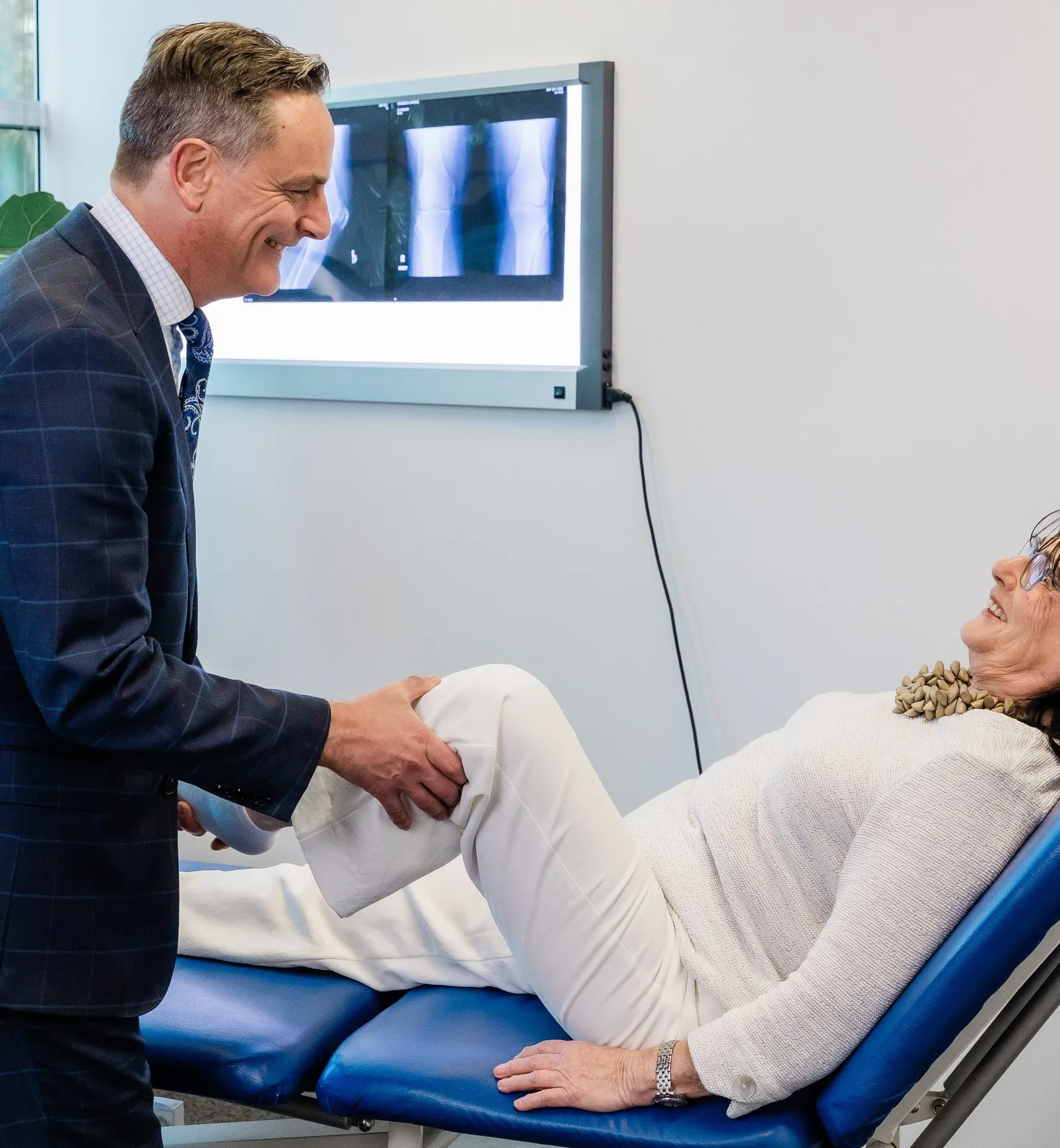 Dr Limbers examining a patient’s knee