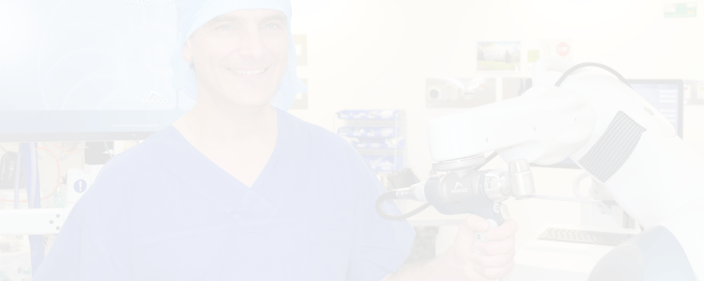 dr-john-limbers-with-surgery-robot